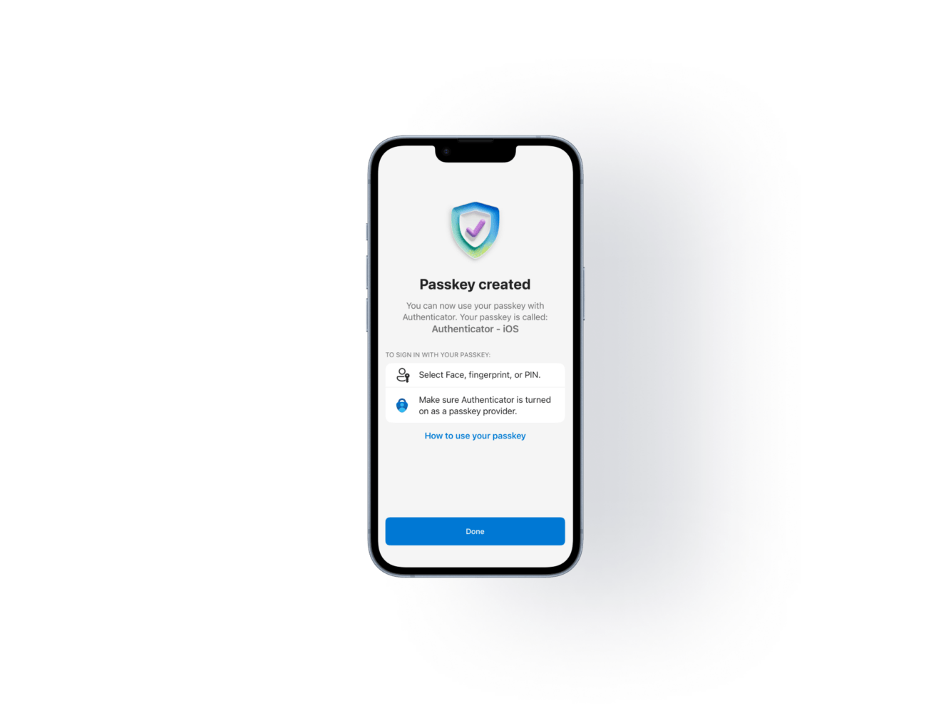 iPhonen näyttökuva, jossa Microsoft Authenticator vahvistaa passkeyn luonnin onnistuneen ("Passkey created"). Passkeyn luontia käsittelevän artikkelin kansikuva.